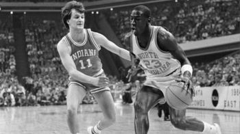 Michael Jordan (23) of North Carolina drives to the basket during first half action 3/22 as Dan Dakich covers him.