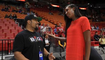 Big 3 league founder, Ice Cube, speaks with former WNBA player Lisa Leslie before a game during Big 3-Week Five at American Air