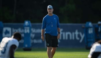 Colts head coach Frank Reich walks in front of his team before a 2019 Training Camp practice at Grand Park.