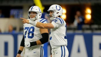 Colts quarterback Andrew Luck talks with center Ryan Kelly before a 2018 game at Lucas Oil Stadium.