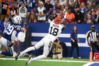 A.J. Green of the Bengals halls in a touchdown pass over Colts safety Malik Hooker