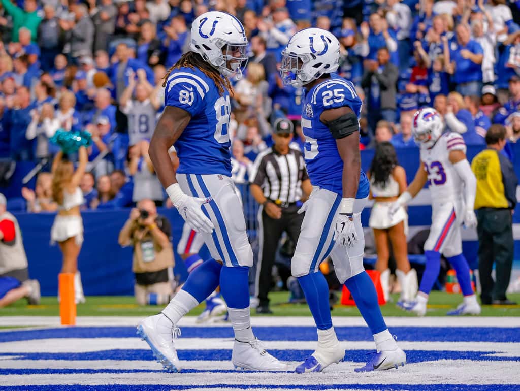 Colts players Marlon Mack and Mo Alie-Cox high five after a touchdown against the Bills during the 2018 season.
