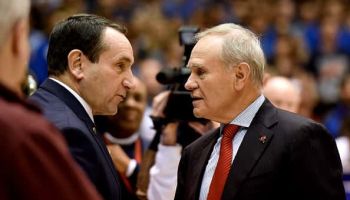 Head coach Mike Krzyzewski (L) of the Duke Blue Devils talks with assistant coach Ed Schilling of the Indiana Hoosiers