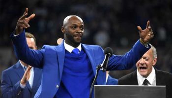 Reggie Wayne gestures while speaking to fans as he is inducted to the Indianapolis Colts Ring of Honor at Lucas Oil Stadium