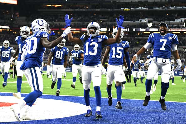 The Indianapolis Colts celebrate after a touchdown in the game against the Tennessee Titans in the third quarter at Lucas Oil