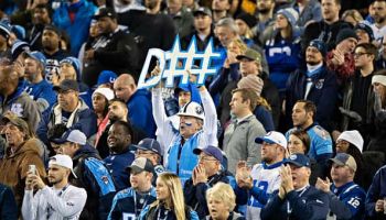 Fan of the Tennessee Titans holds up a defense sign during a game against the Indianapolis Colts at Nissan Stadium