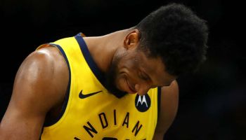 Pacers forward Thaddeus Young walks off the court with his head down in a blowout loss to the Celtics.