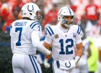 Quarterback Andrew Luck #12 of the Indianapolis Colts laughs with teammate quarterback Jacoby Brissett #7 of the Indianapolis C