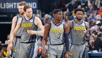#3 Aaron Holiday, #23 Wesley Matthews, #44 Bojan Bogdanovic, and Domas Sabonis of the Pacers walk on the court