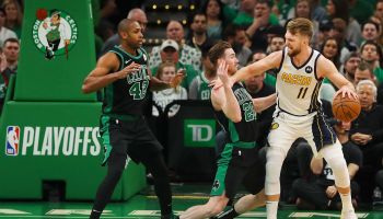 Pacers big man, #11, Domas Sabonis, battles down low in the post against Gordon Hayward of the Celtics