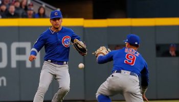 Javier Baez, #9 of the Chicago Cubs dives for a fly ball against the Atlanta Braves