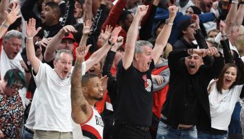 Damian Lillard reacts after hitting a 37-foot game winner against the Thunder. Portland fans cheer crazily in the background