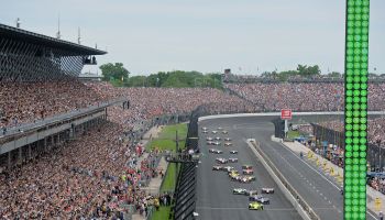 IndyCar driver Simon Pagenaud (22) of the Menards Team Penske Chevrolet leads the field tot he green flag for the start of the