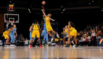 Indiana Fever forward Candice Dupree (4) goes up with Chicago Sky forward Jantel Lavender (7) for the opening tip off during the