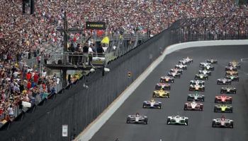 Simon Pagenaud of France, driver of the #22 Menards Team Penske Chevrolet leads the field at the start of the 103rd running of t