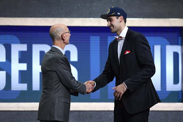 Goga Bitadze poses with NBA Commissioner Adam Silver after being drafted with the 18th overall pick by the Indiana Pacers