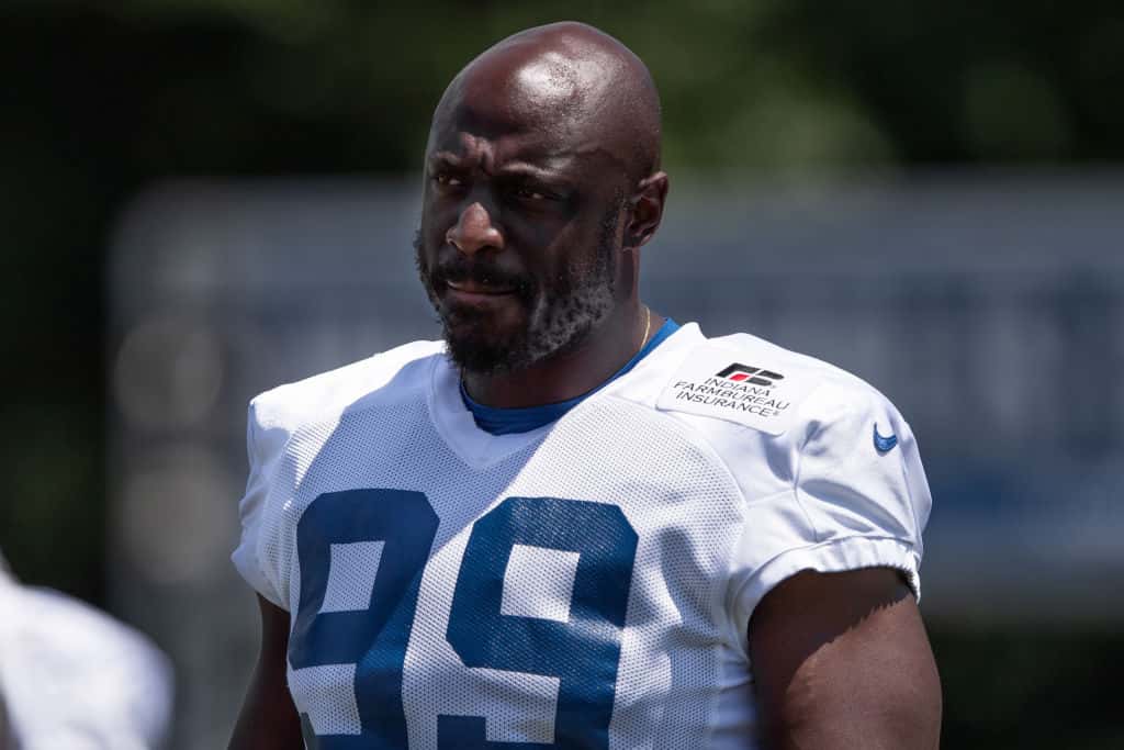 Colts defensive end Justin Houston gets ready to practice before a 2019 camp session at Grand Park.