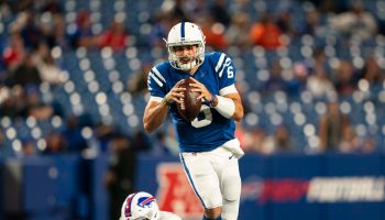 : Indianapolis Colts Quarterback Chad Kelly (6) rolls out and looks to pass the ball avoiding Buffalo Bills