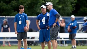 Head coach Frank Reich talks with Adam Vinatieri during the Colts' training camp at Grand Park