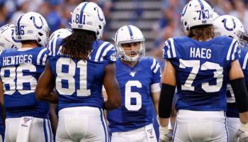 Colts quarterback Chad Kelly talks to the offense in a huddle during a 2019 preseason game against the Bears.