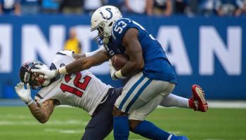 Colts linebacker Darius Leonard stiffs arm Texans wideout Kenny Stills during a 2019 game.