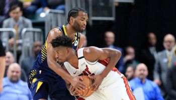 Pacers forward T.J. Warren guards Heat forward Jimmy Butler during a 2020 game at Bankers Life Fieldhouse.