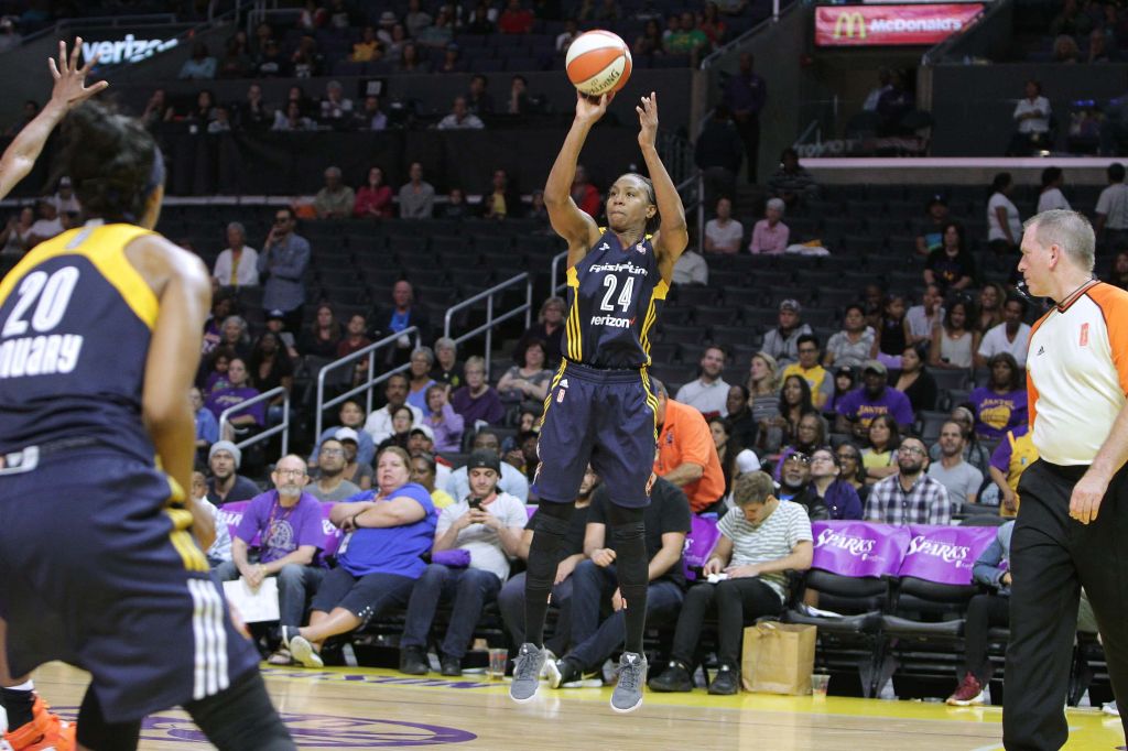 Tamika Catchings, #24 of the Indiana Fever shoots a 3 pointer