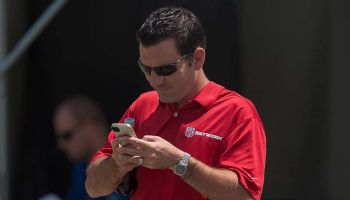 NFL Networks reporter Ian Rapoport checks his phone during the Indianapolis Colts Training Camp