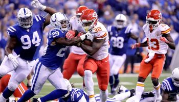 Former Chiefs running back Spencer Ware tries to break a tackle in a game against the Colts in January 2014.