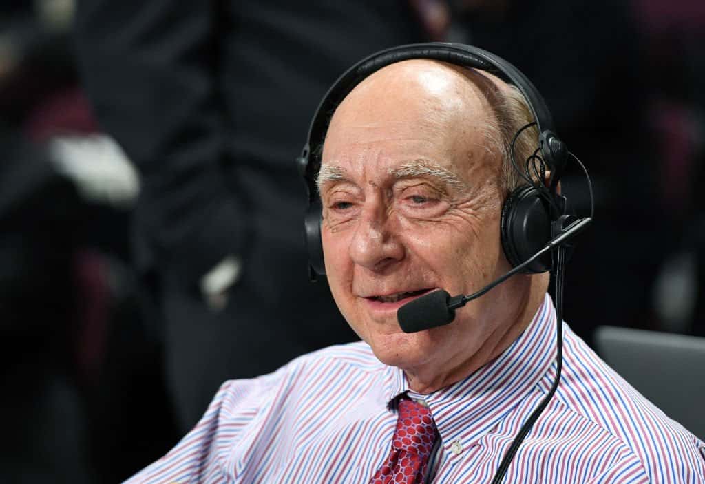 Sportscaster Dick Vitale broadcasts before a semifinal game of the West Coast Conference Basketball Tournament