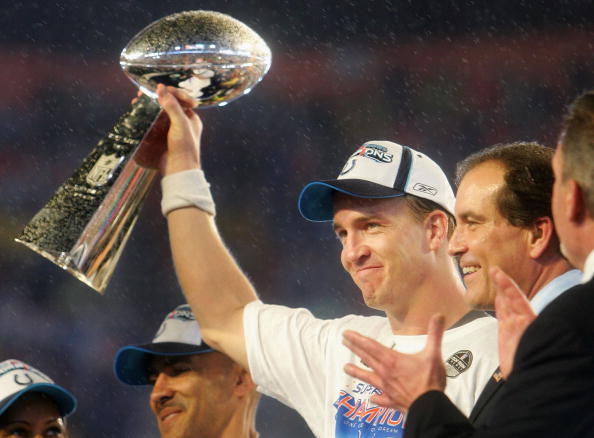 Quarterback Peyton Manning #18 of the Indianapolis Colts celebrates with the Vince Lombardi Super Bowl trophy