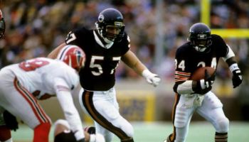 Chicago Bears Hall of Fame running back Walter Payton (34) follows guard Tom Thayer (57) November 24, 1985, at Soldier Field
