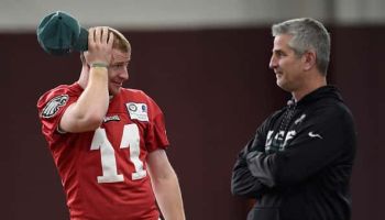 Philadelphia Eagles quarterback Carson Wentz talks with offensive coordinator Frank Reich during practice.