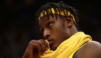 Myles turner of the Indiana Pacers looks on from the bench late in the fourth quarter while playing the Cavaliers.