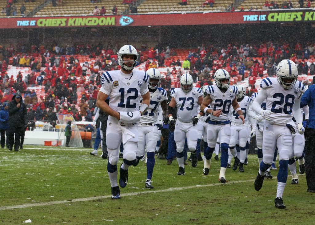 The Colts run off the field during a playoff game against the Chiefs
