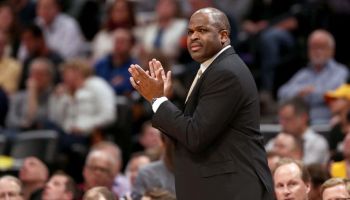 Nate McMillan coaching from the sideline