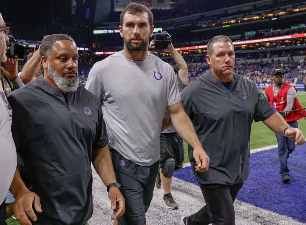 Andrew Luck #12 of the Indianapolis Colts walks off the field following reports of his retirement from the NFL
