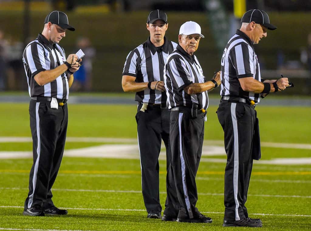 Football referees standing together before the game