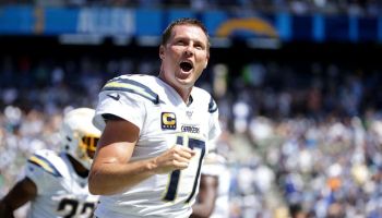 Former Chargers QB Philip Rivers pumps his fist during a 2019 game.