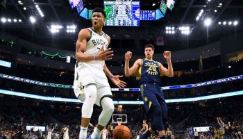Bucks forward Giannis Antetokounmpo finishes off a dunk attempt in a 2020 game.