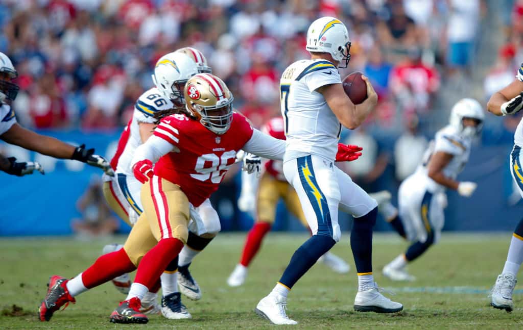 Former 49ers defensive lineman Sheldon Day gets ready to tackle Philip Rivers.