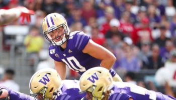 Former Washington QB-Jacob Eason looks down the line of scrimmage in a 2019 game.