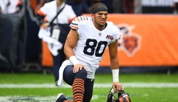 Trey Burton takes a knee before a Chicago Bears game