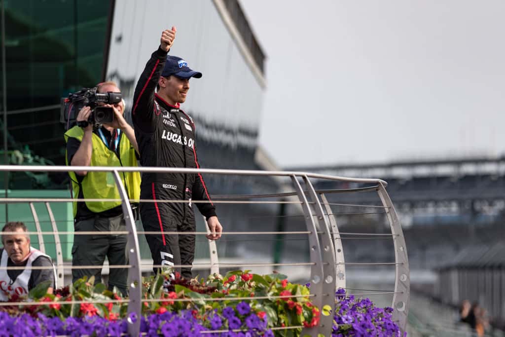 Robert Wickens gives a thumbs up to the crowd in victory circle at Indianapolis Motor Speedway