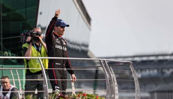 Robert Wickens gives a thumbs up to the crowd in victory circle at Indianapolis Motor Speedway