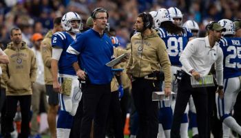 Colts offensive coordinator Nick Sirianni talks to Frank Reich during a game.