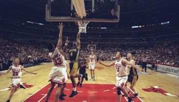 Travis Best #4 of the Indiana Pacers shoots over Scottie Pippen #33 of the Chicago Bulls during an Eastern Conference Final game at the United Center in Chicago, Illinois.