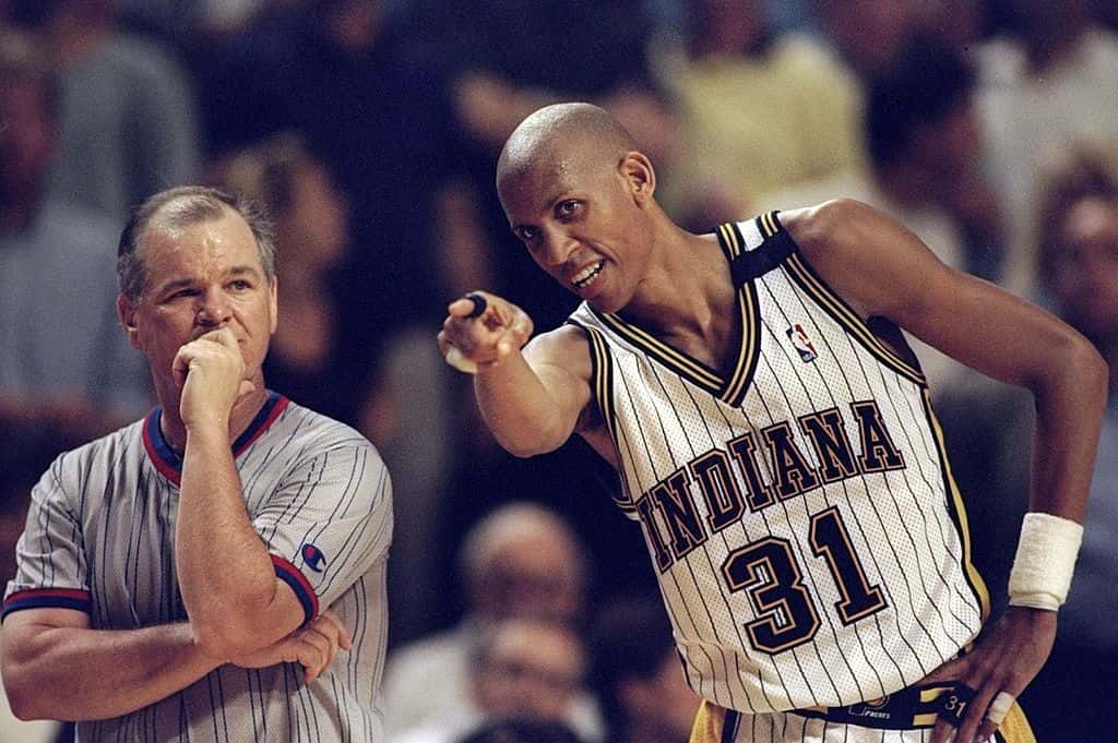 Reggie Miller #31 of the Indiana Pacers gestures as referee Jerry Crawford looks on during an Eastern Conference Final game against the Chicago Bulls at the Market Square Arena in Indianapolis, Indiana.