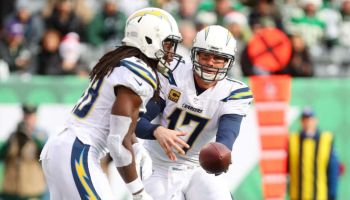 Philip Rivers hands off the ball in a game with the Chargers.