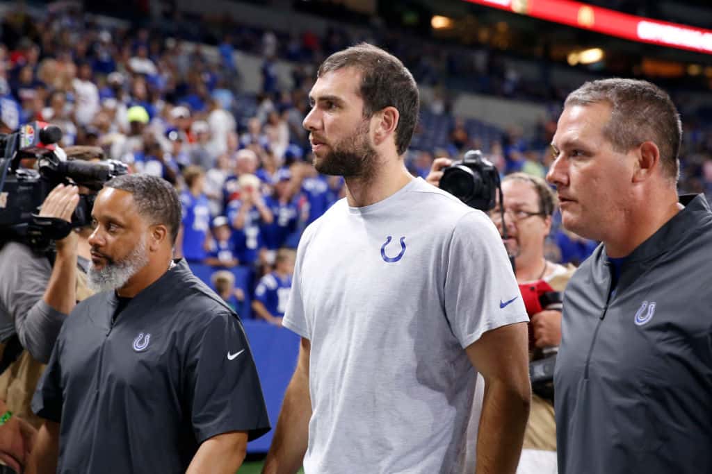 Andrew Luck #12 of the Indianapolis Colts walks off the field after a report of his retirement after the Indianapolis Colts preseason game against the Chicago Bears at Lucas Oil Stadium on August 24, 2019 in Indianapolis, Indiana